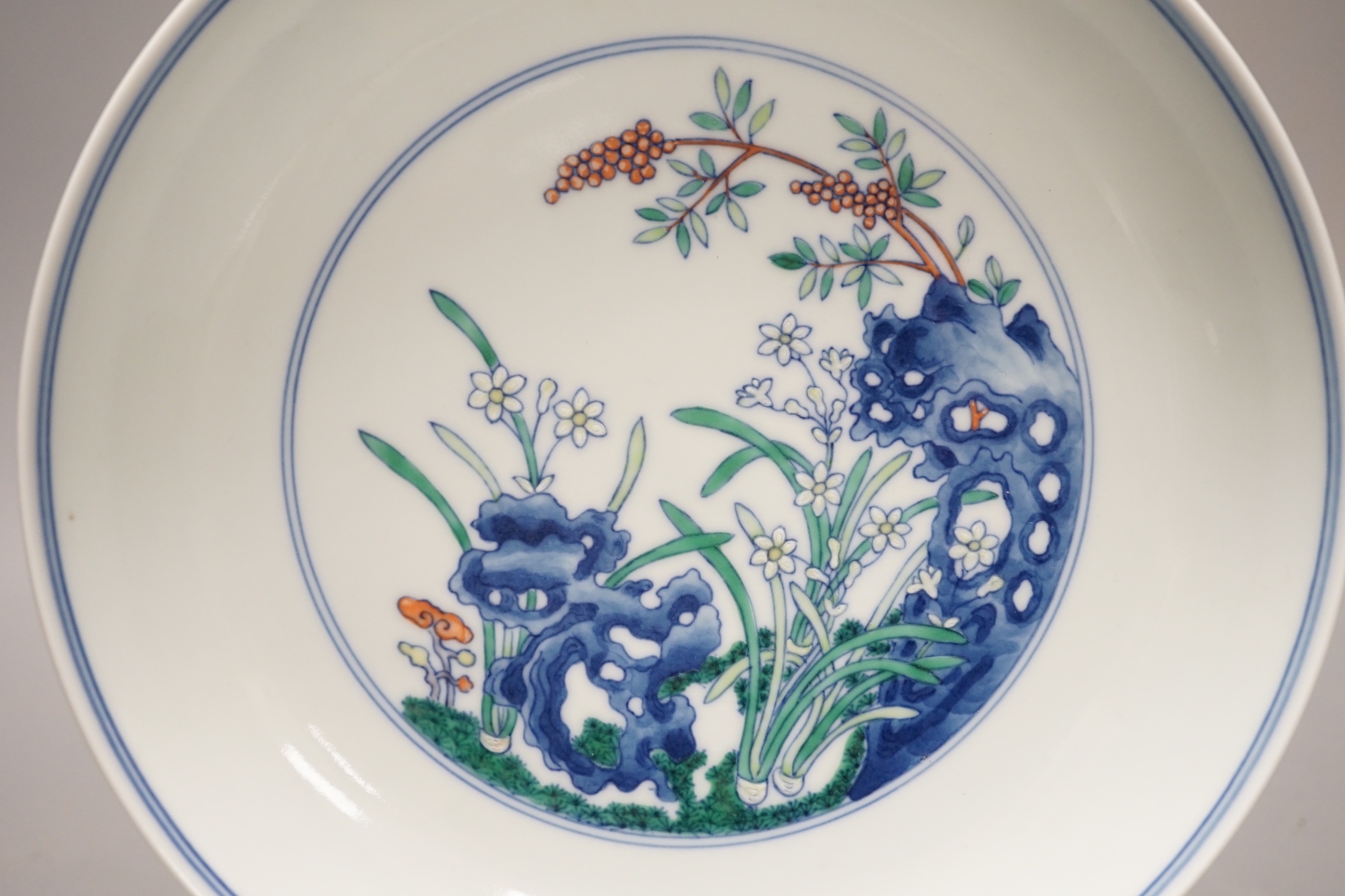 A Chinese doucai saucer dish, Yongzheng mark but later 20cm diameter